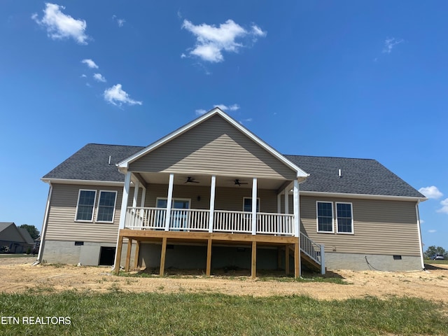 back of property with ceiling fan