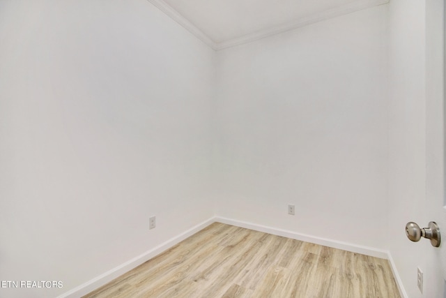 unfurnished room featuring light hardwood / wood-style flooring and ornamental molding