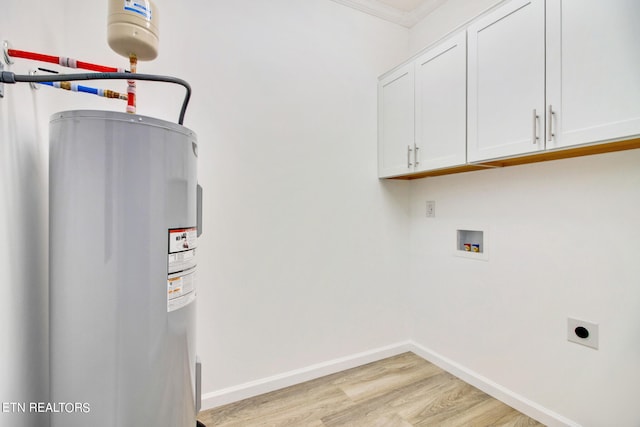 clothes washing area with cabinets, hookup for an electric dryer, water heater, crown molding, and light hardwood / wood-style floors