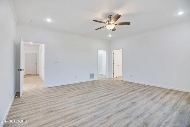 spare room with light hardwood / wood-style flooring, ceiling fan, and ornamental molding