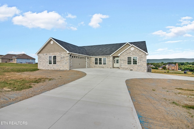 view of front of property featuring a mountain view and a garage