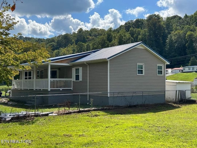 view of property exterior with a yard