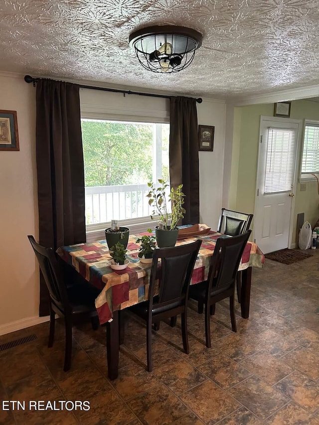 dining room featuring a textured ceiling