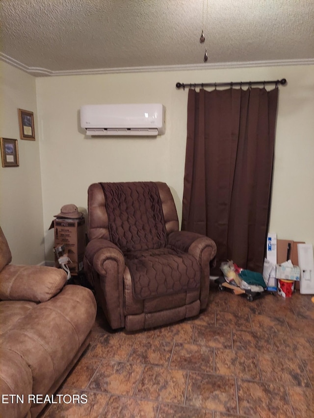 living room with an AC wall unit and a textured ceiling