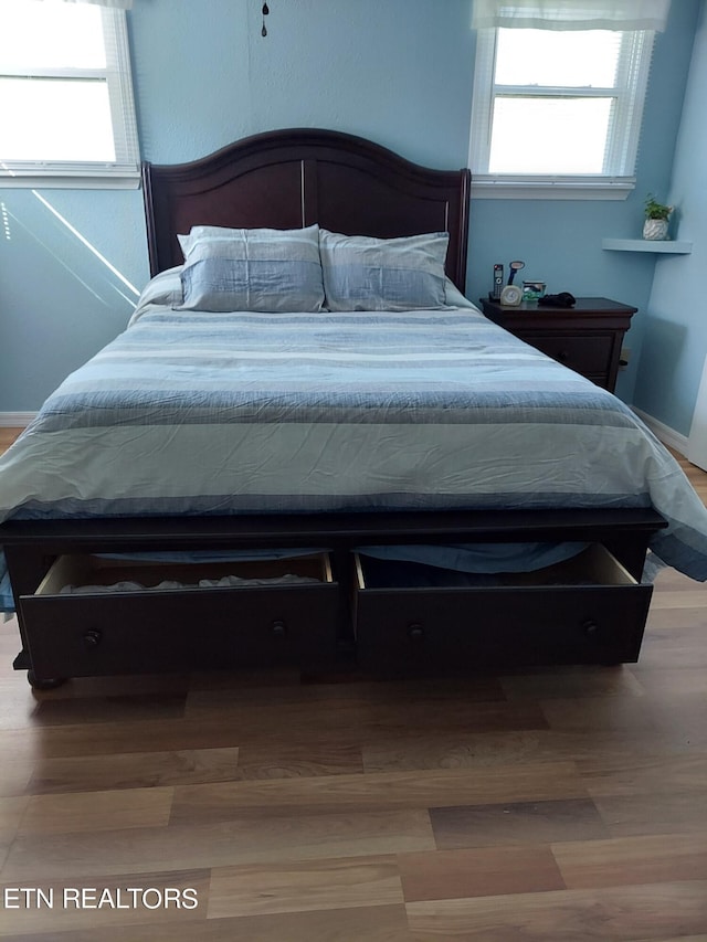 bedroom featuring light wood-type flooring