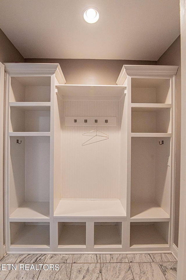 mudroom featuring marble finish floor and recessed lighting