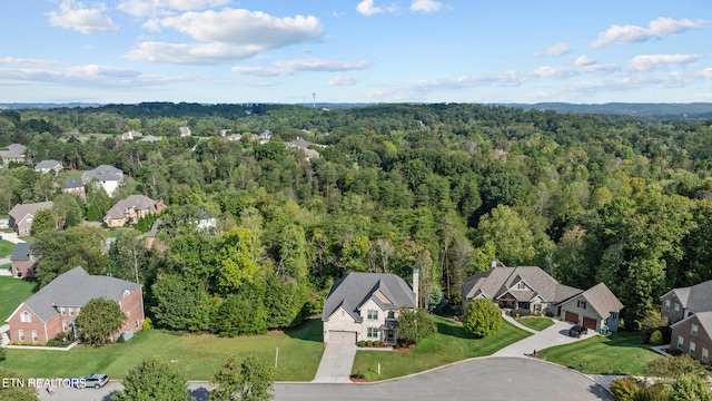 aerial view featuring a residential view and a view of trees