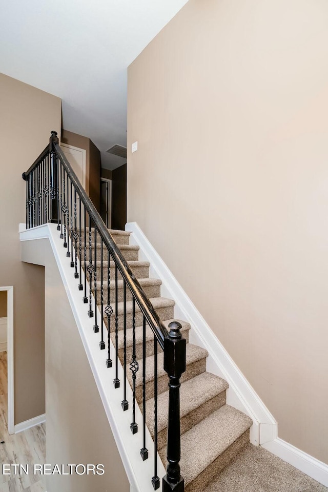 staircase with baseboards