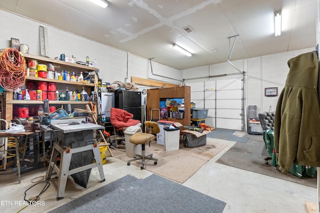 garage with black refrigerator