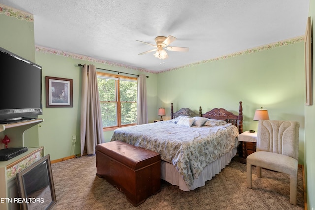 bedroom with a textured ceiling, ceiling fan, and carpet