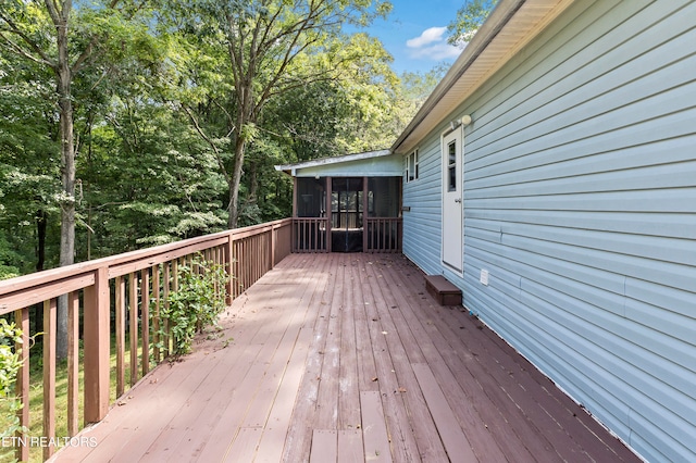 deck with a sunroom