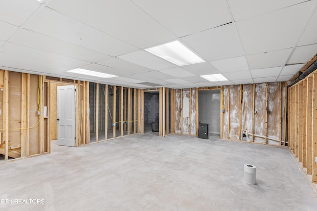 basement featuring a drop ceiling