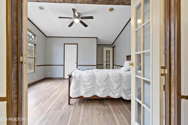 bedroom with wood-type flooring, french doors, ceiling fan, and ornamental molding