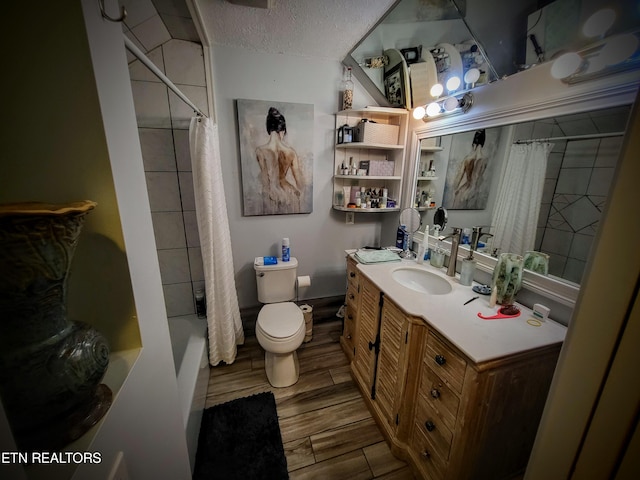 full bathroom featuring a textured ceiling, vanity, hardwood / wood-style floors, toilet, and shower / bathtub combination with curtain