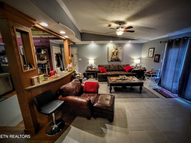 tiled living room featuring ceiling fan, a textured ceiling, and ornamental molding