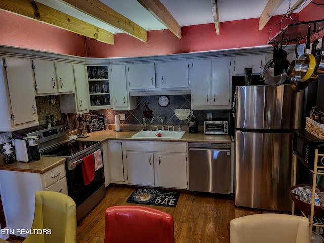 kitchen featuring white cabinetry, stainless steel appliances, sink, and dark hardwood / wood-style floors