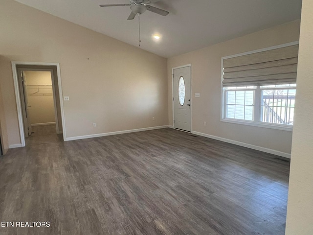 foyer entrance with dark wood-type flooring and ceiling fan