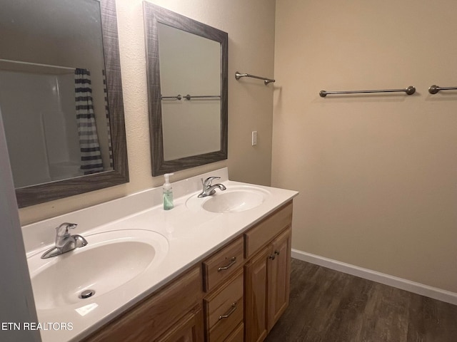 bathroom featuring vanity, hardwood / wood-style floors, and a shower with curtain