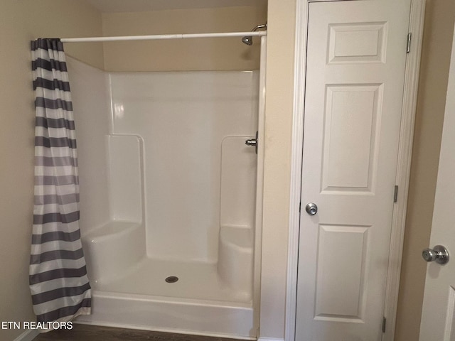 bathroom featuring a shower with curtain