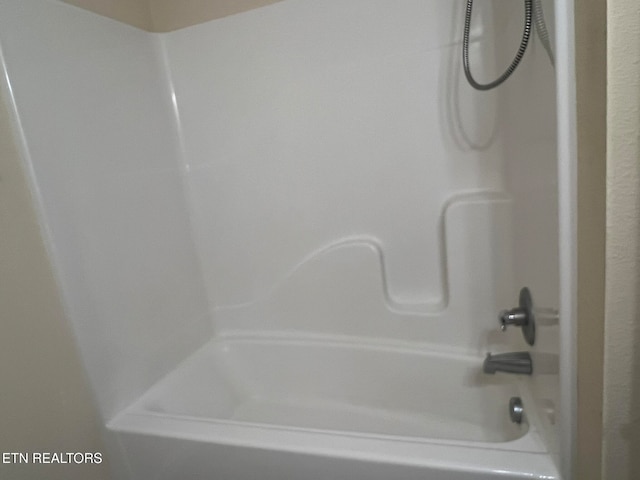 bathroom with shower / bathtub combination