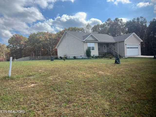 view of front of house featuring a garage and a front lawn