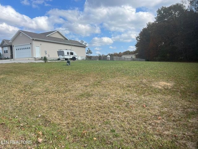 view of yard with a garage