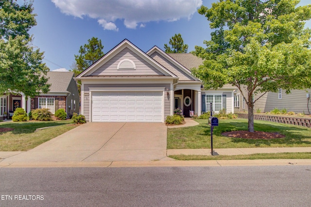 view of front facade featuring a garage and a front yard