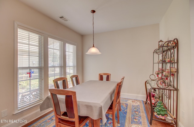 dining room with hardwood / wood-style floors