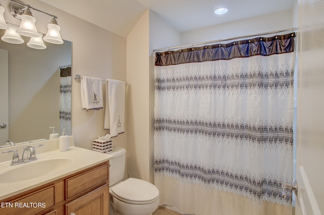 bathroom featuring a shower with shower curtain, vanity, toilet, and a notable chandelier