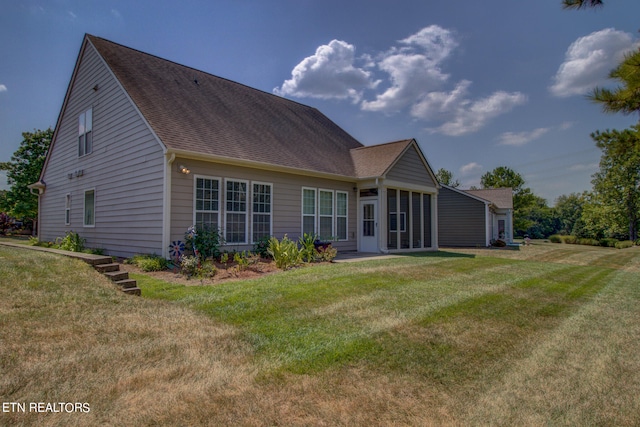 back of house with a yard