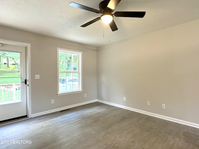 unfurnished room with wood-type flooring and ceiling fan