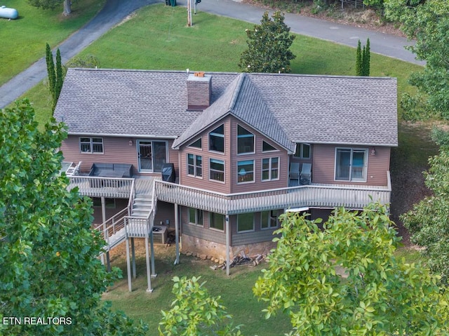 back of house featuring a wooden deck, a yard, and cooling unit