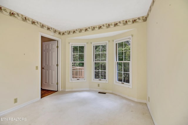 view of carpeted spare room