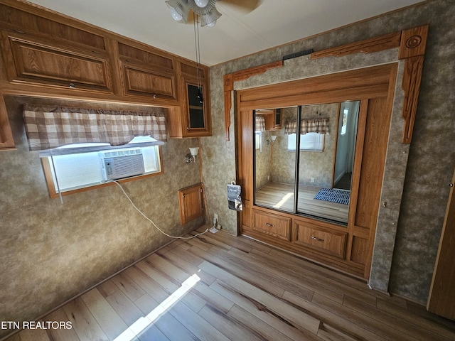 interior space featuring hardwood / wood-style floors and ceiling fan