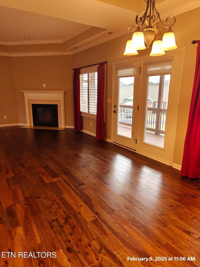 unfurnished living room with crown molding, a fireplace, baseboards, and dark wood-style flooring