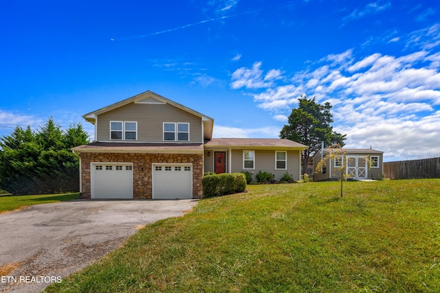 view of front facade featuring a front yard and a garage