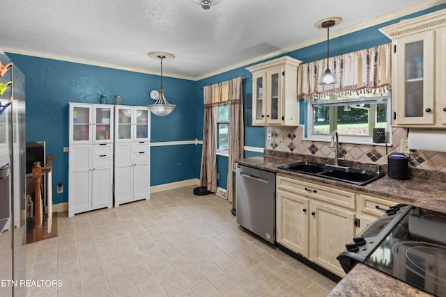 kitchen with stainless steel dishwasher, a healthy amount of sunlight, and decorative light fixtures