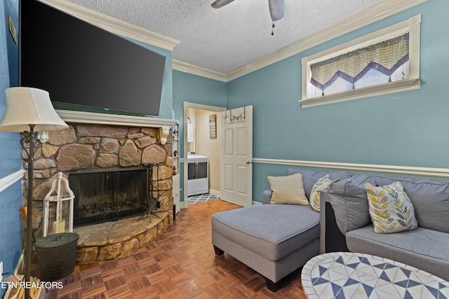 living room with parquet floors, a stone fireplace, a textured ceiling, ceiling fan, and ornamental molding