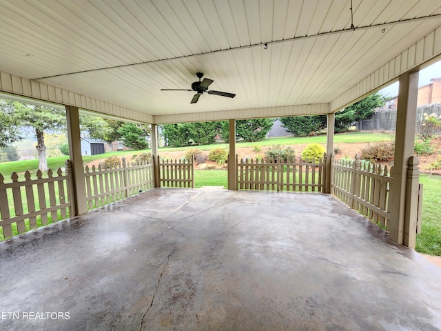 view of patio / terrace featuring a storage shed and ceiling fan