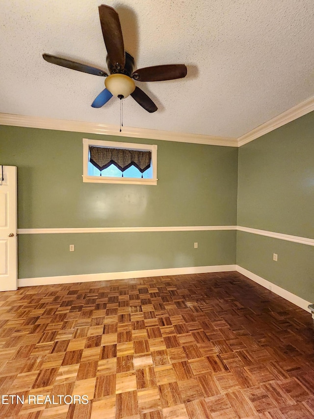 unfurnished room with parquet flooring, ornamental molding, a textured ceiling, and ceiling fan