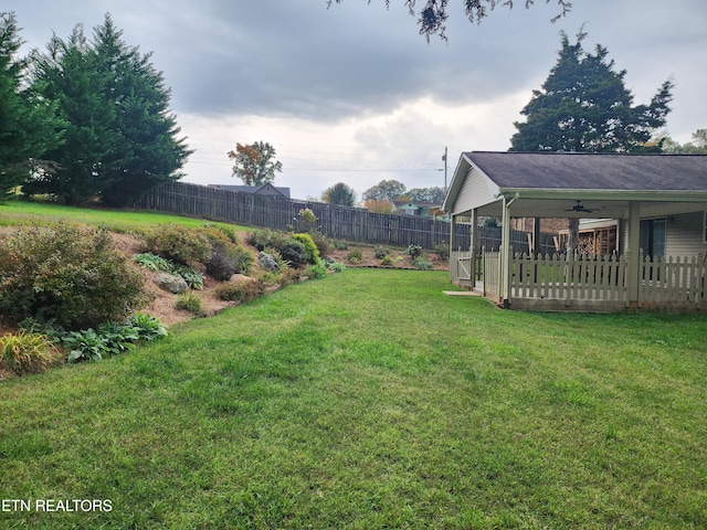 view of yard featuring ceiling fan