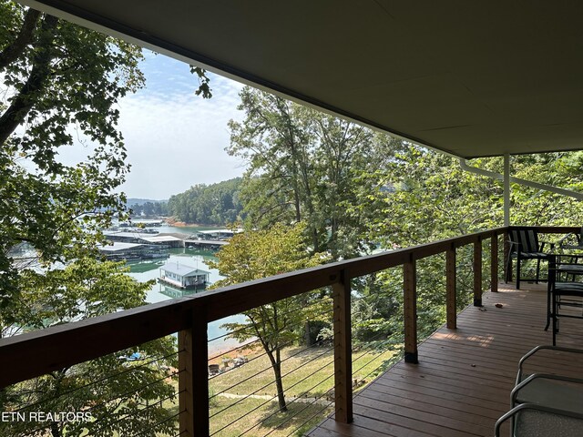 wooden deck featuring a water view