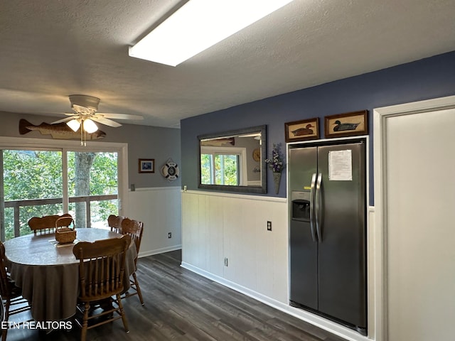 dining space featuring plenty of natural light, ceiling fan, and dark hardwood / wood-style floors