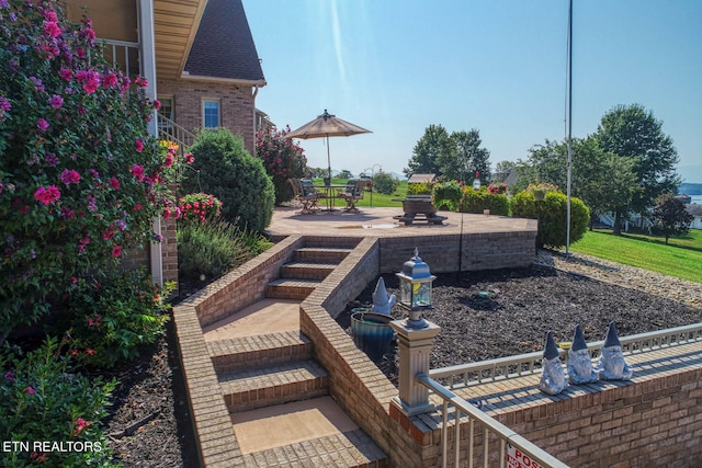 view of yard with an outdoor fire pit and a patio area