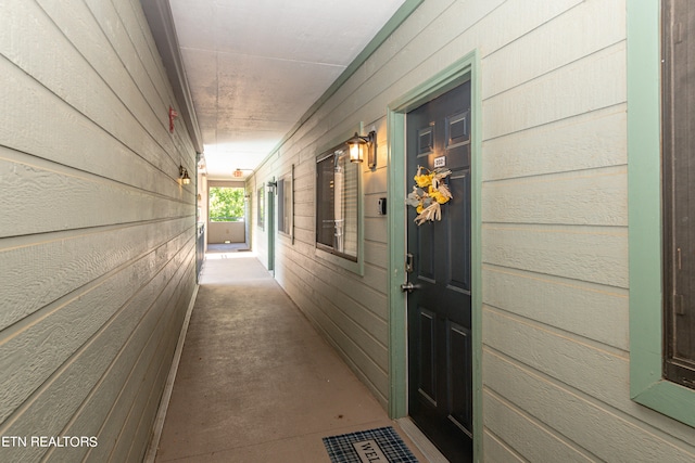 view of exterior entry with a porch