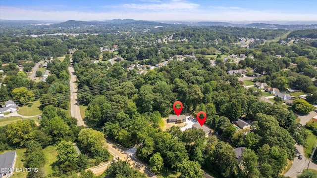 bird's eye view featuring a view of trees