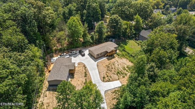 aerial view featuring a forest view