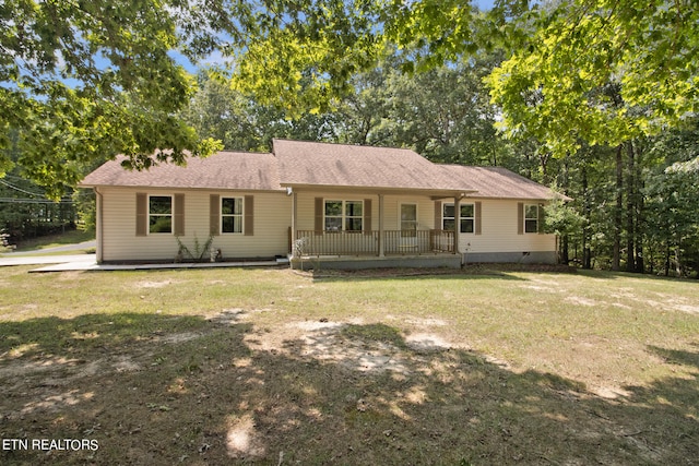 ranch-style house featuring a front lawn