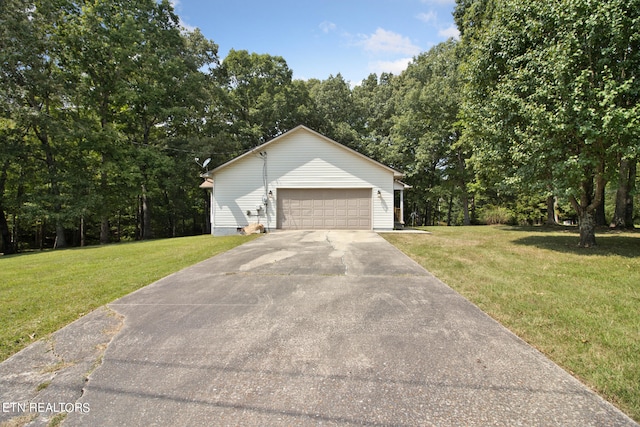 view of front of house with a front yard and a garage