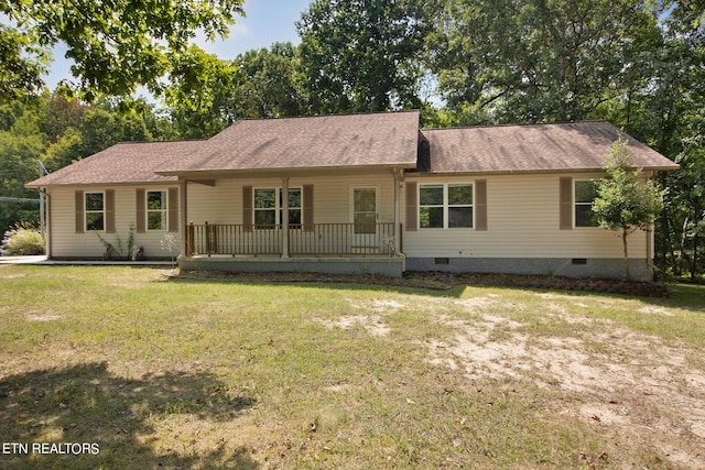 ranch-style home with a front lawn